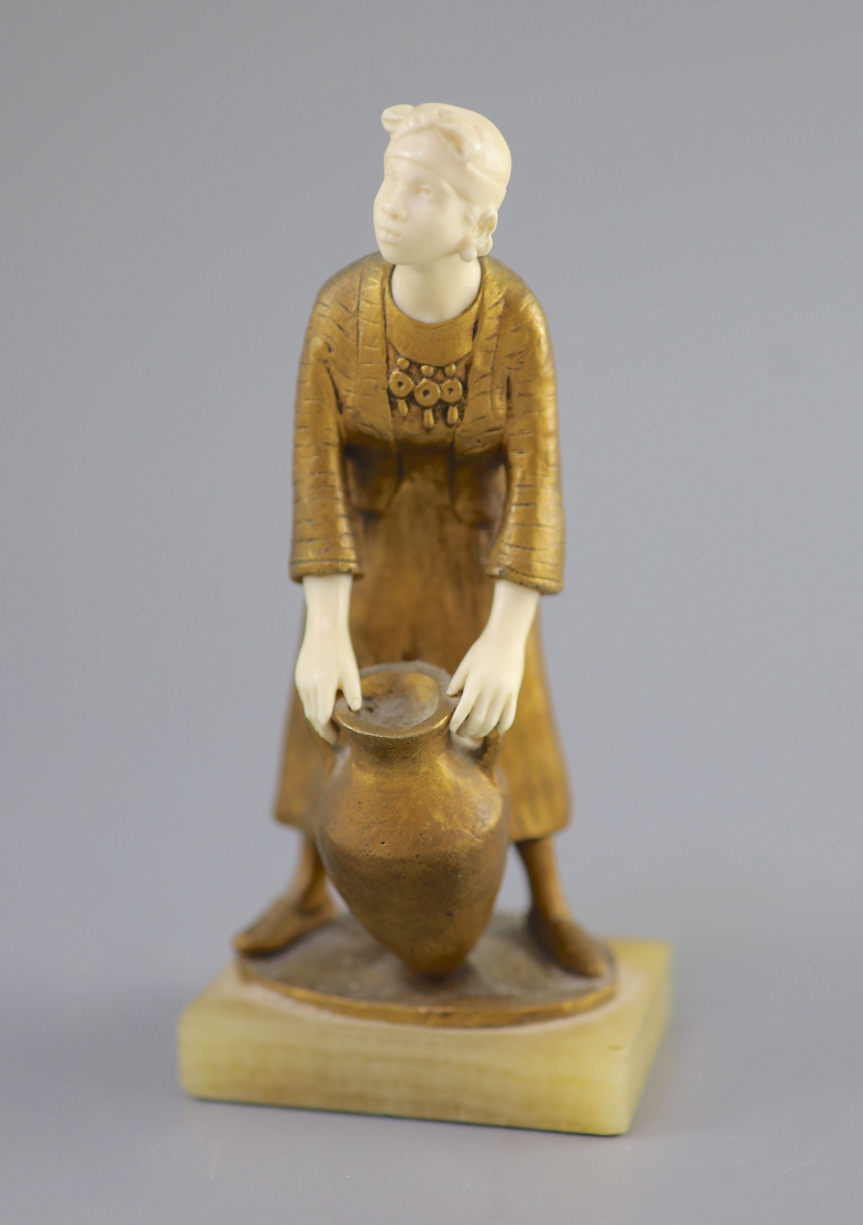 Hélène Maynard White (American, b.1870). A bronze and ivory study of an African girl with amphora base, c1920, 19cm high